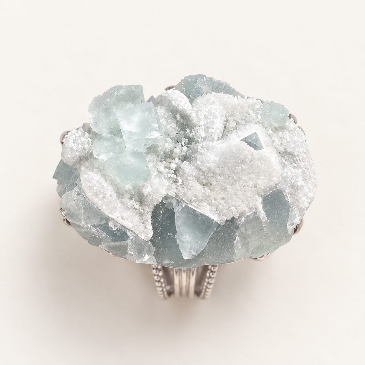 Glacier Bloom Ring top view showing the irregular pale aqua natural-stone texture