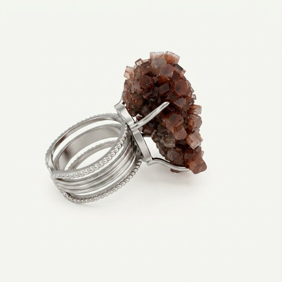 Terracotta Bloom ring in earth and rose tones, shown at a three-quarter angle.