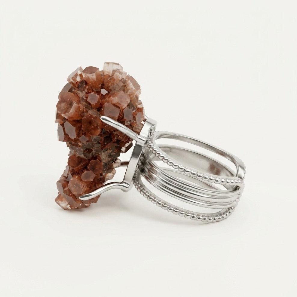 Terracotta Bloom ring in earth and rose tones, shown from the rear with its visible ring silhouette.
