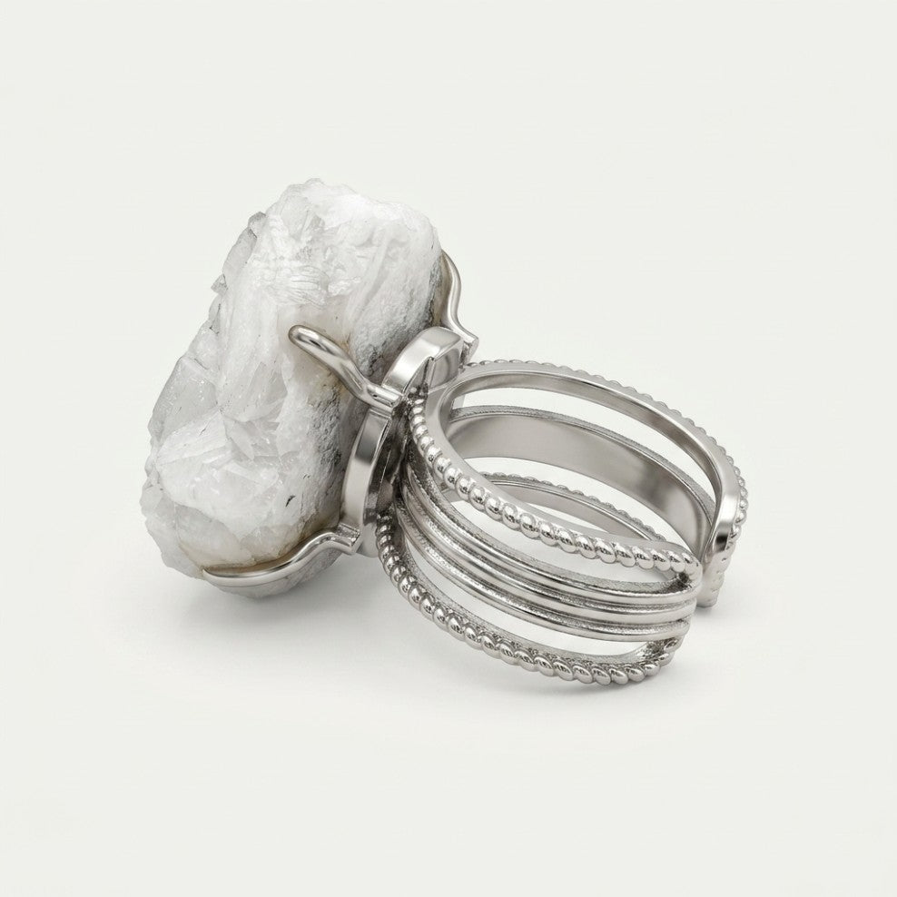 Pale Monolith ring in pale tones, shown from the rear with its visible ring silhouette.