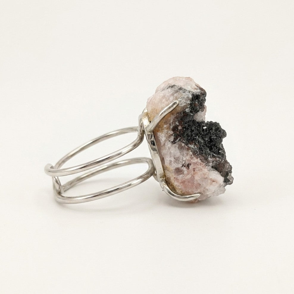 Midnight Ridge ring in dark tones, shown from the rear with its visible ring silhouette.