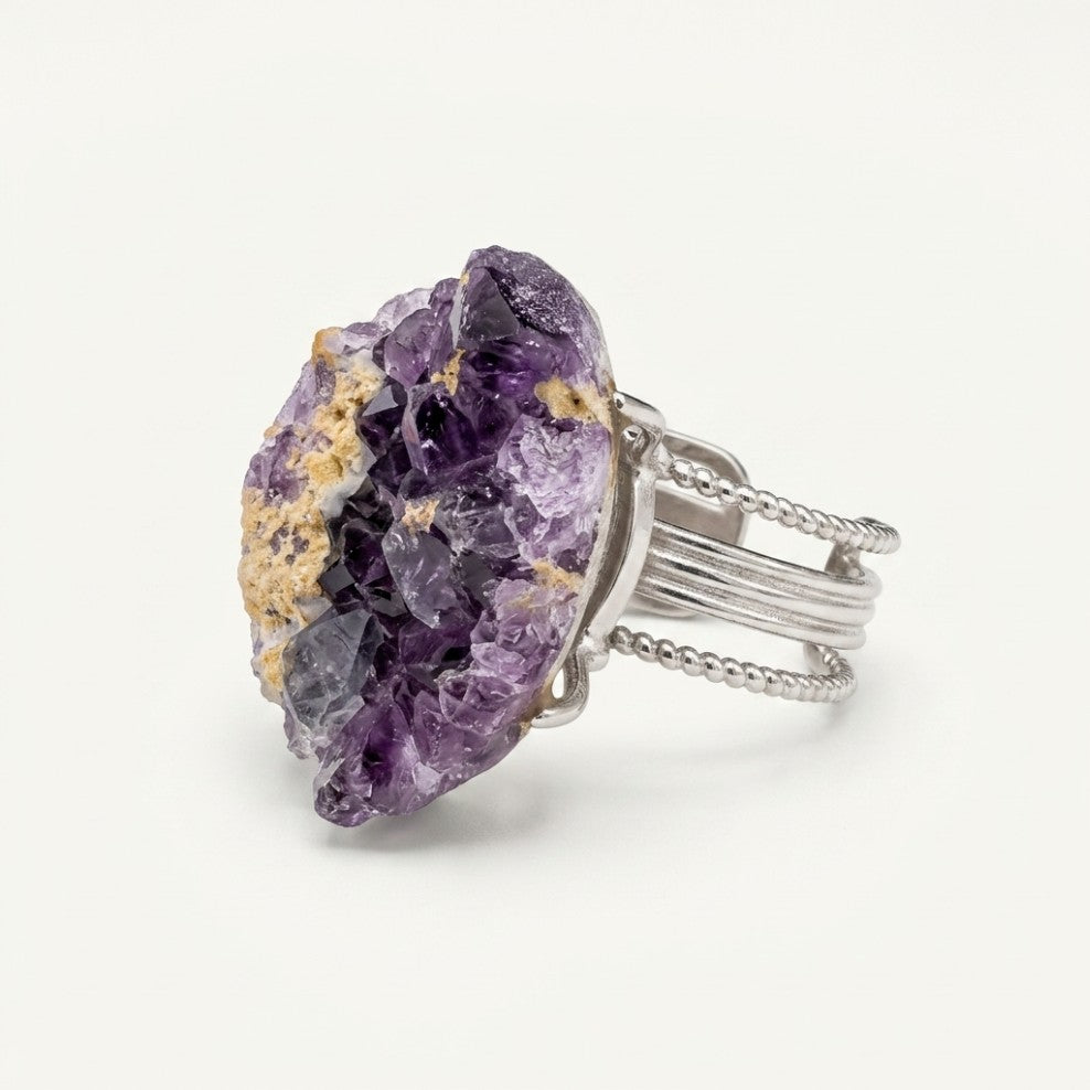 Front view of Amethyst Horizon, a sculptural ring with violet and warm-gold variation.