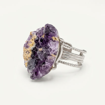 Front view of Amethyst Horizon, a sculptural ring with violet and warm-gold variation.