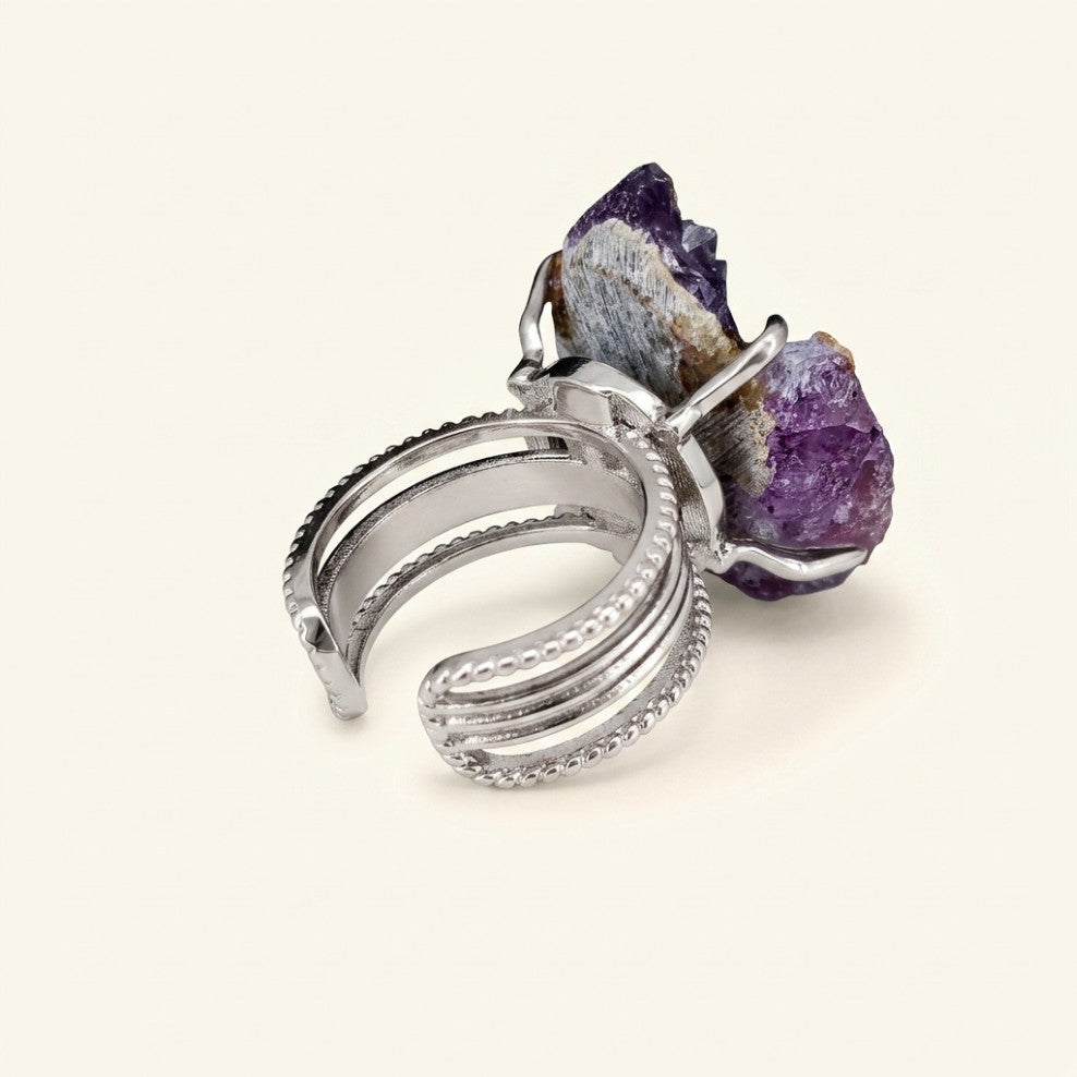 Three-quarter view of Amethyst Horizon, showing its sculptural silhouette and violet and warm-gold variation.