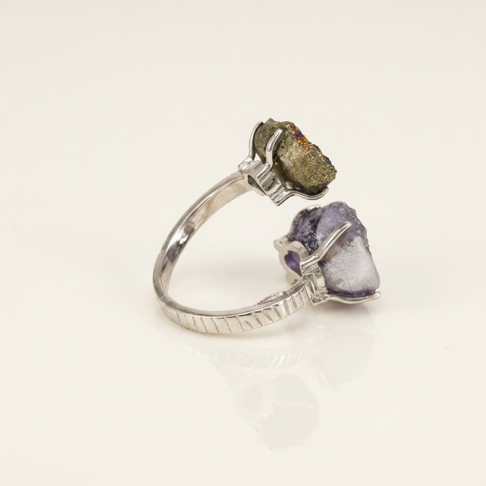 JWL-025 Balance sculptural ring shown from the rear, with both forms and the ring silhouette visible.