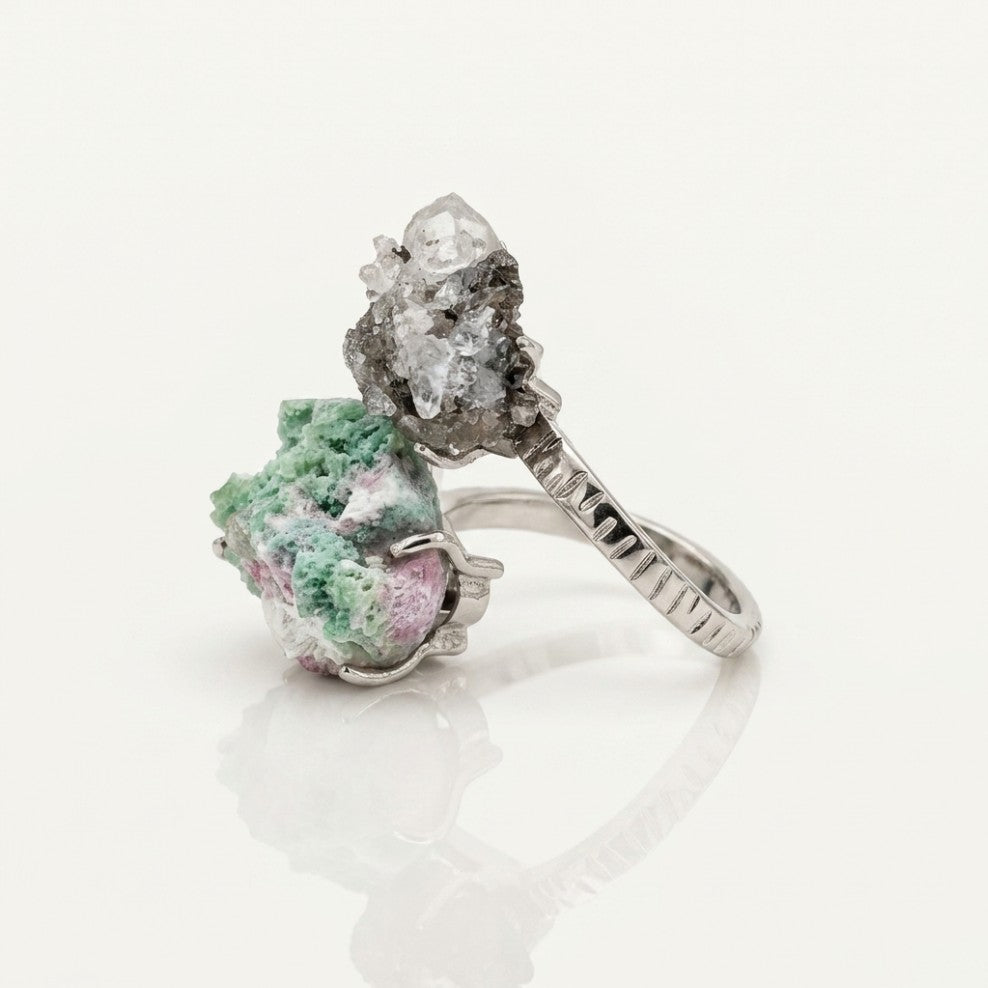 Verdant Bridge ring in green and silver tones, shown from the rear with its visible ring silhouette.