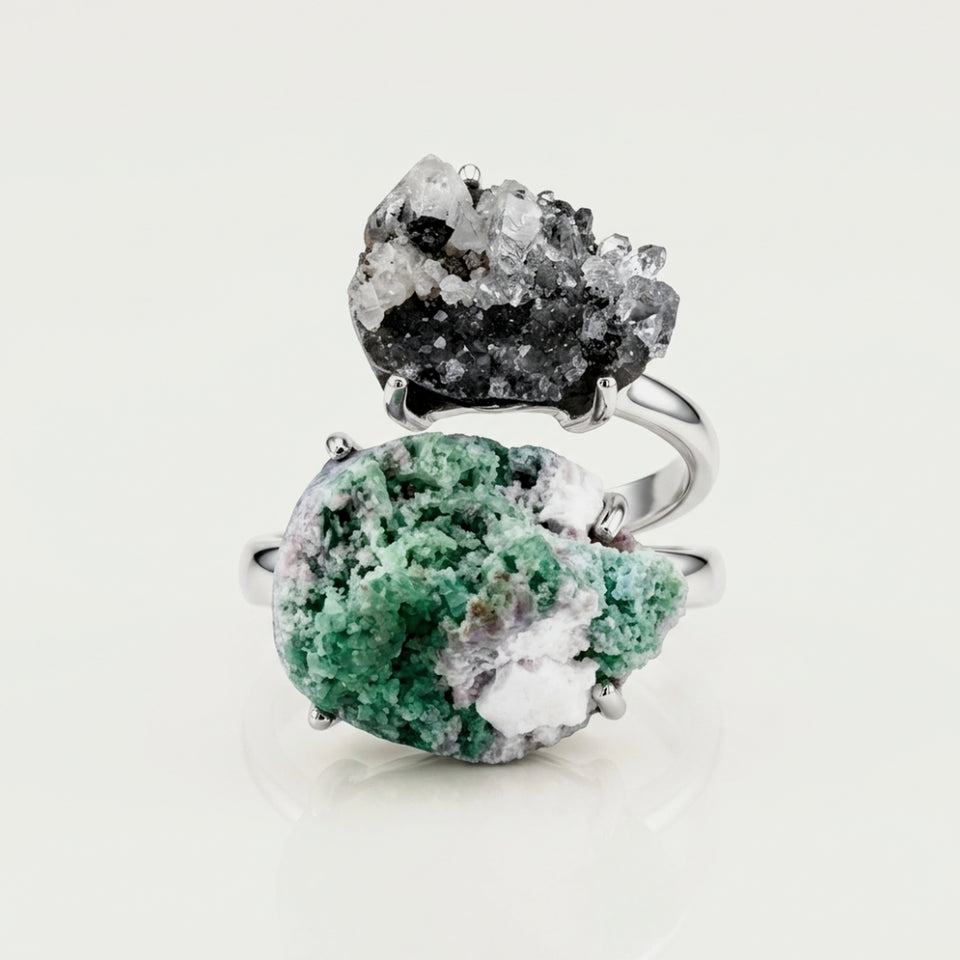 Front view of Verdant Bridge, a sculptural ring with green and silver-toned contrast.